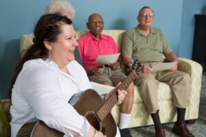 elder group of people listening to live music