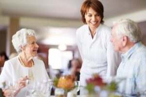 Younger lady with two older people